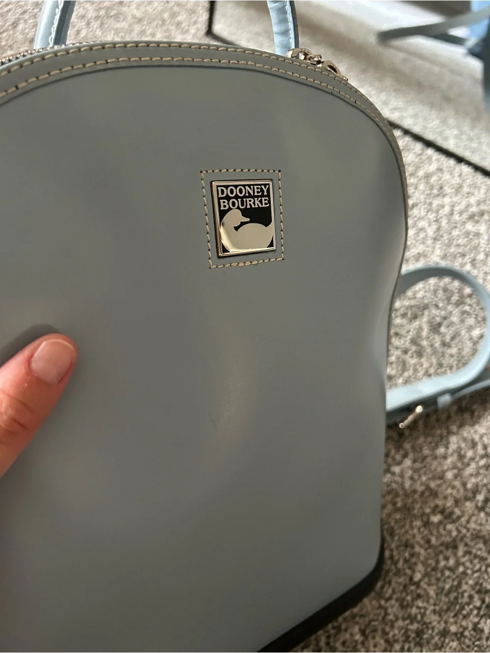 Dooney & Bourke “Pod Backpack” light blue